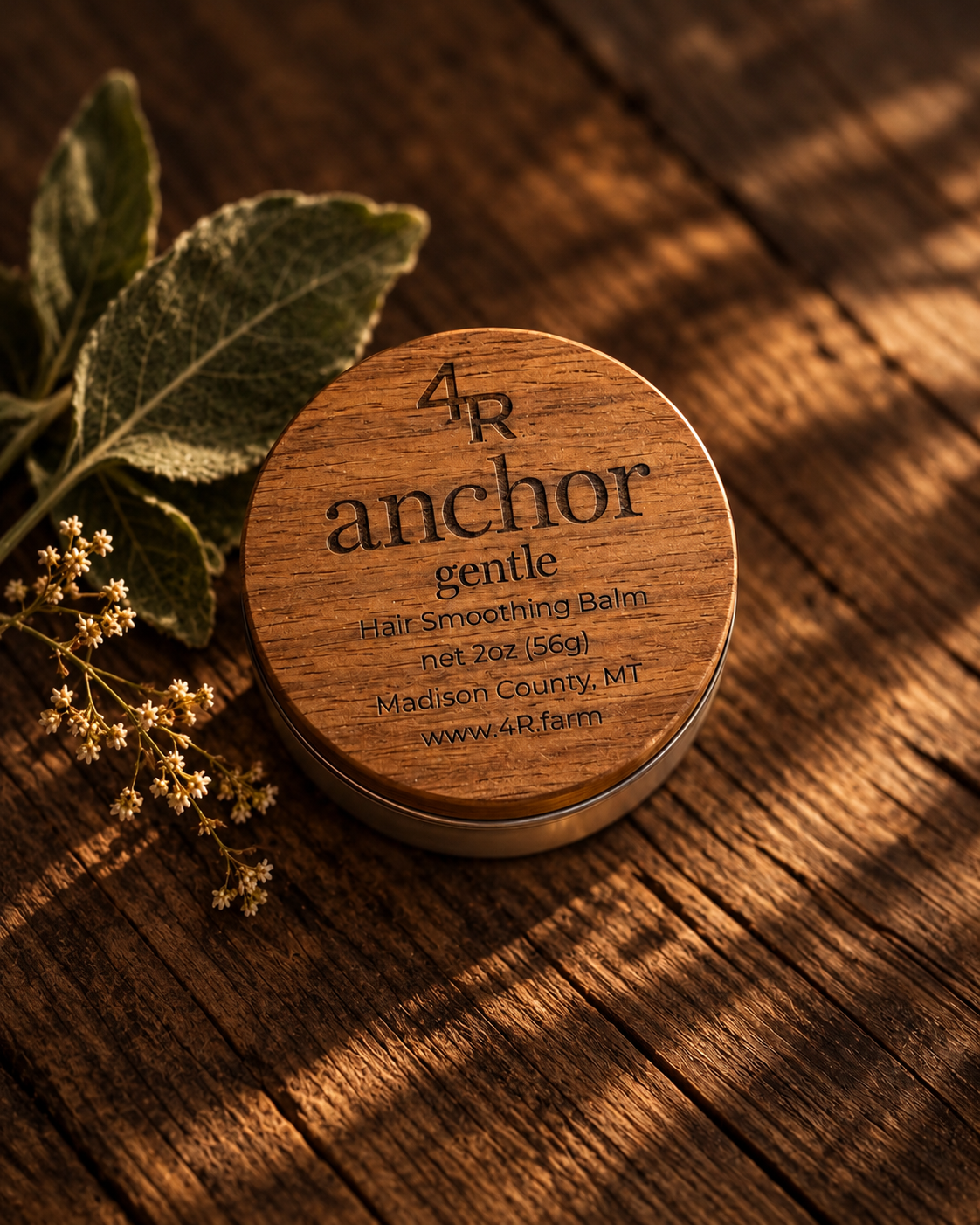 ANCHOR GENTLE Hair Smoothing Balm in a walnut-lidded tin with sage and dried flowers