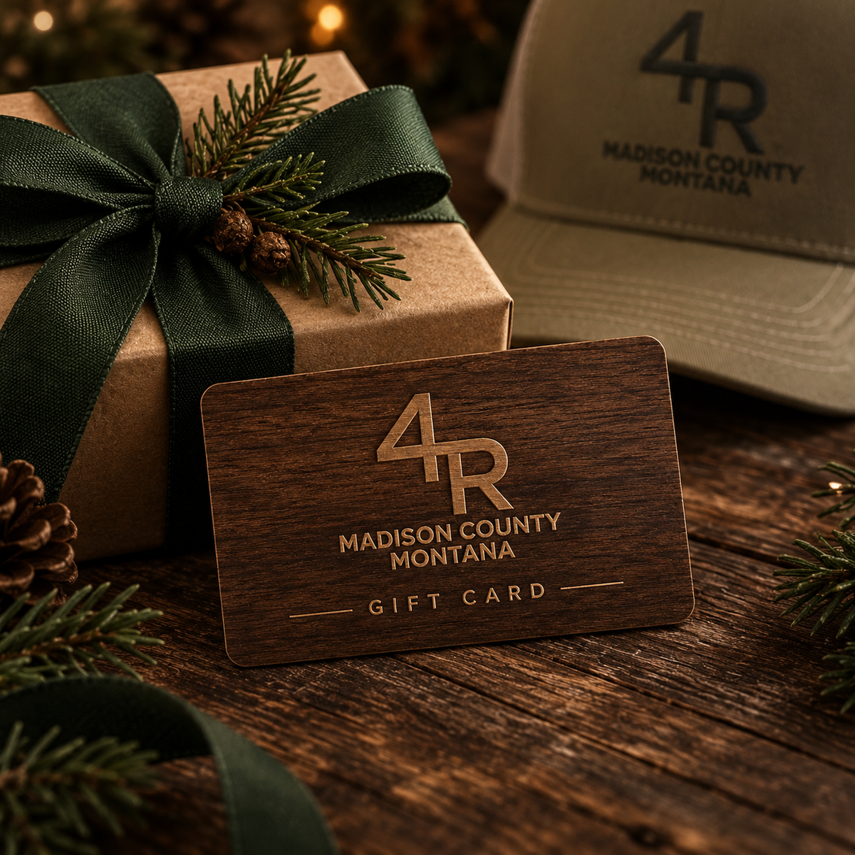 Wooden 4R Farm gift card beside a ribboned gift box, evergreen sprigs, and a 4R cap.