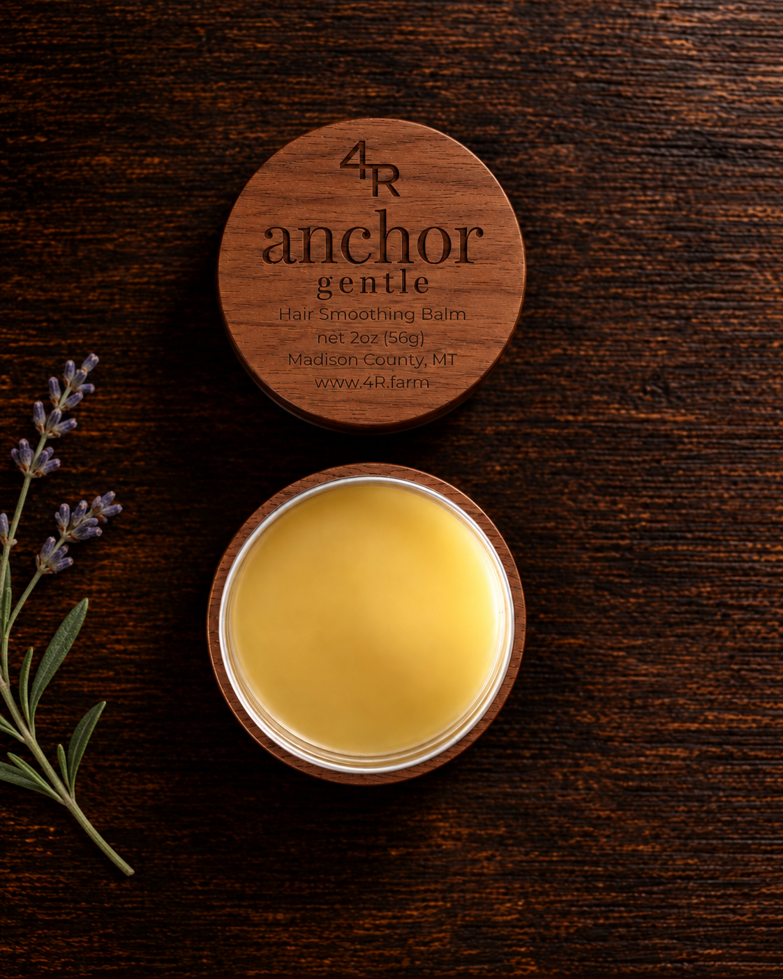 Open ANCHOR GENTLE Hair Smoothing Balm beside its walnut lid and a lavender sprig