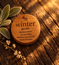 WINTER GENTLE Restorative Facial Moisturizer in a walnut-lidded tin with botanicals