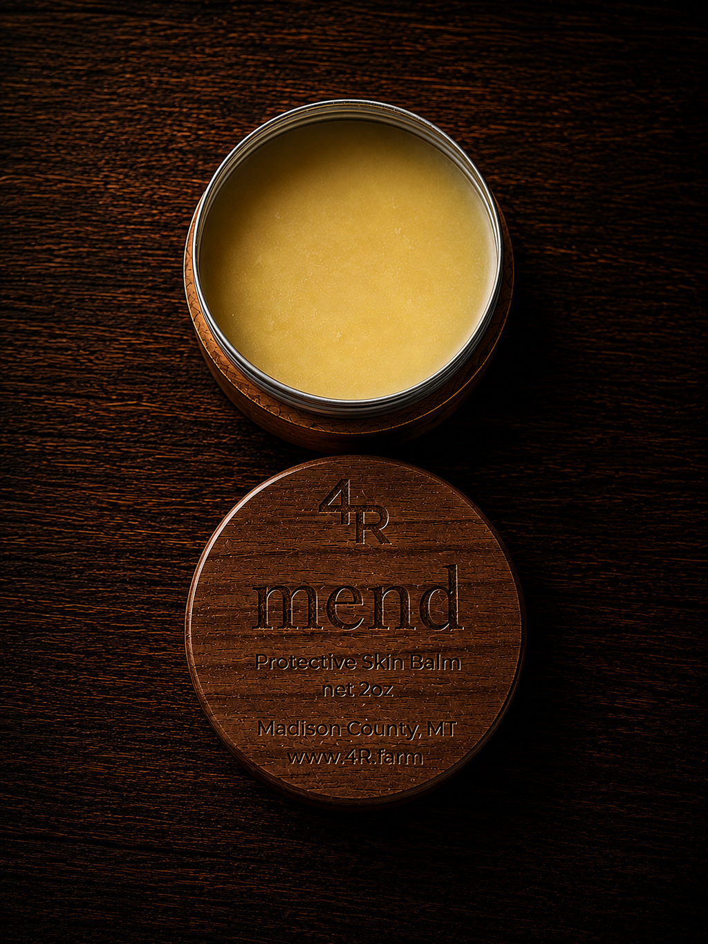Open MEND Protective Skin Balm beside its engraved walnut lid.