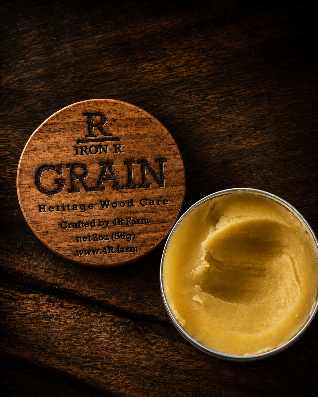 Open tin of IRON R GRAIN Heritage Wood Care beside its engraved walnut lid.