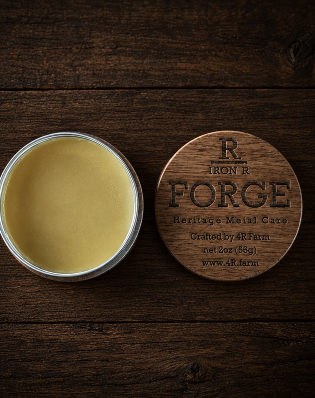 Open tin of IRON R FORGE Heritage Metal Care beside its engraved walnut lid.