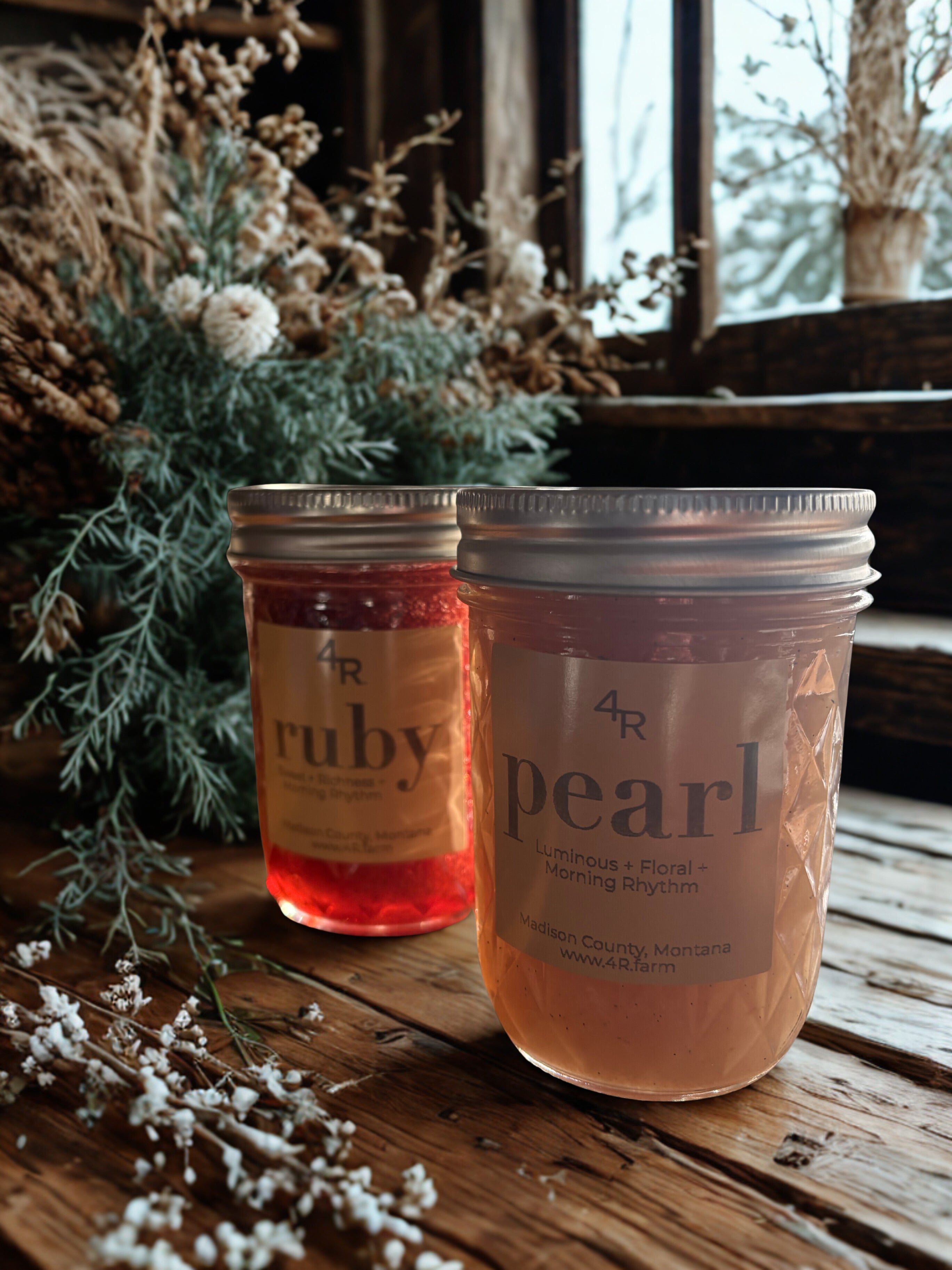 Two jars labeled 'ruby' and 'pearl' on a wooden surface with decorative plants.