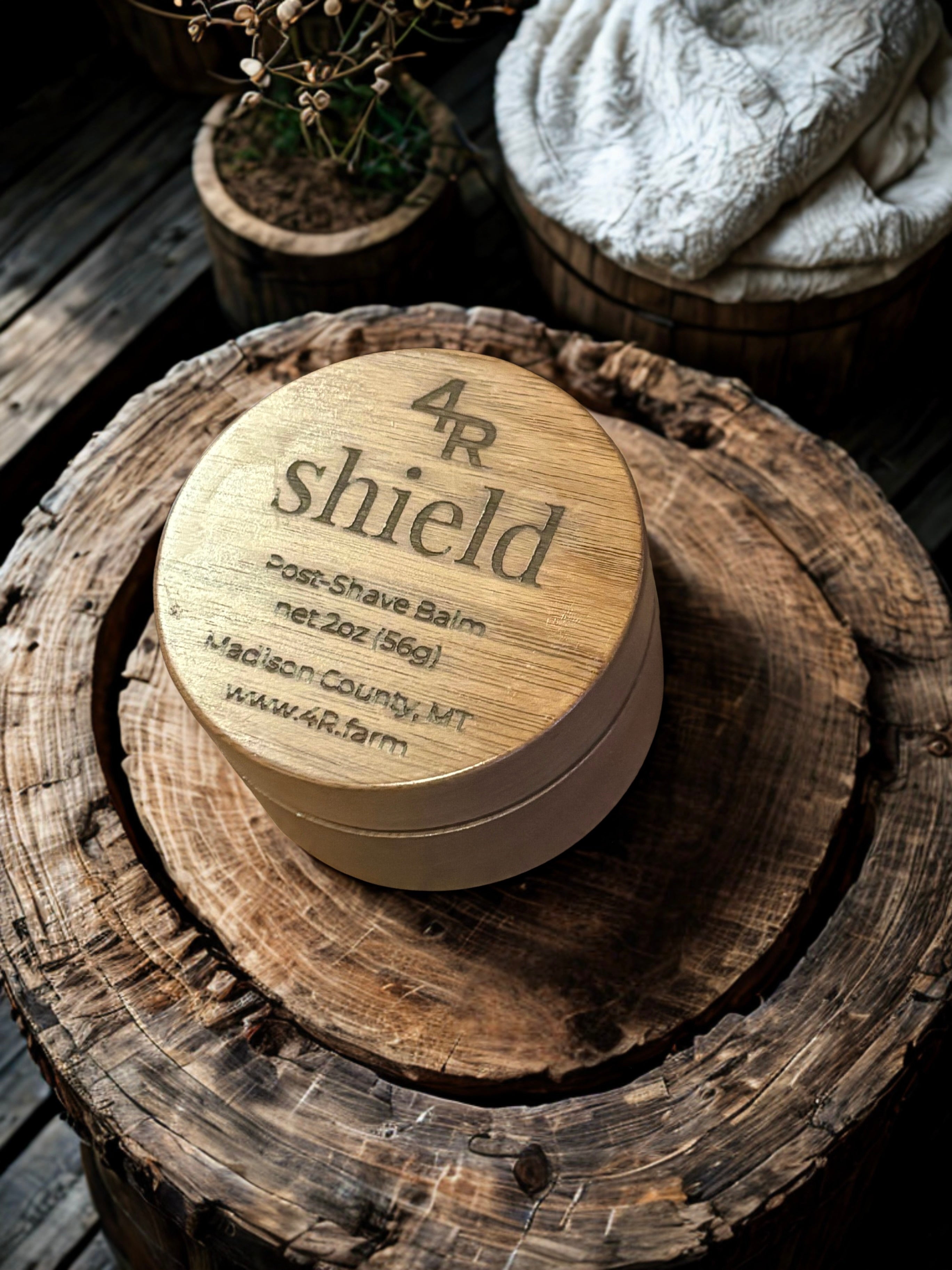 Wooden container labeled '4R shield' on a wooden surface